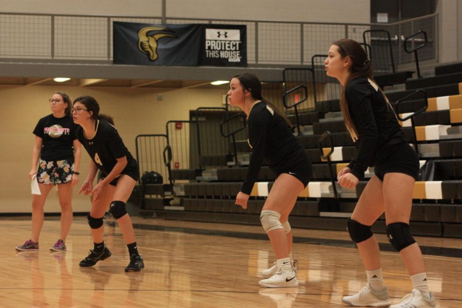Assistant coach Robyn Jaso leads the girls volleyball team through a routine scrimmage during an early practice in September of 2019. Fall sports routinely bring in hundreds from the Maize South community to  the school grounds for athletic competitions.