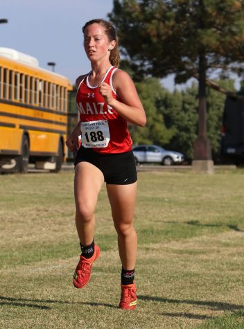 Sophomore Abigail Grantham paces herself during the start of the race. Grantham set her Kansas personal record at 21:49.