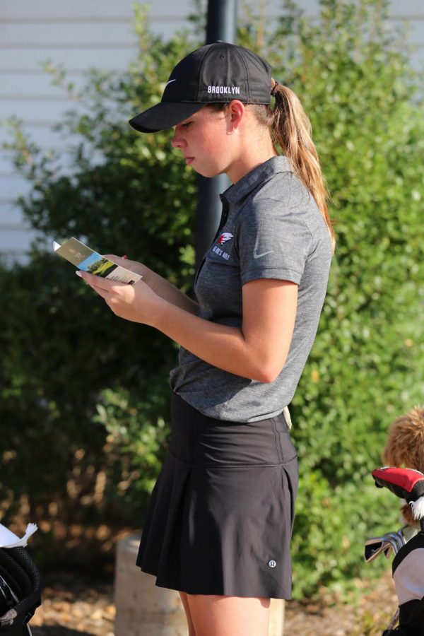 Senior Brooklyn Blasdel counts up her scores after competing. Blasdel placed fifth overall.