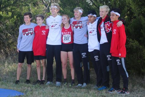 The state qualifying cross country team poses for a photo after competing. 