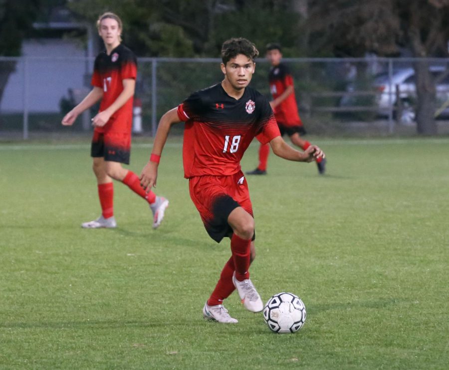 Senior Mikey Valesquez looks for a pass during the first half. Maize beat Newton with a final score of 1-0.