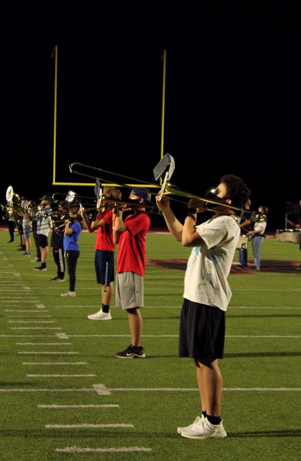 Junior Matthew Guzman and the rest of the band practice for their performance on Oct. 2. 