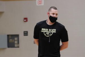 New assistant coach Zach Bush coaches and directs players during try-out week on Wednesday, Nov. 18. With Maize South moving to Division 1 in the AVCTL league, Bush wont get the chance to play his hometown school, the Eisenhower Tigers his first year.