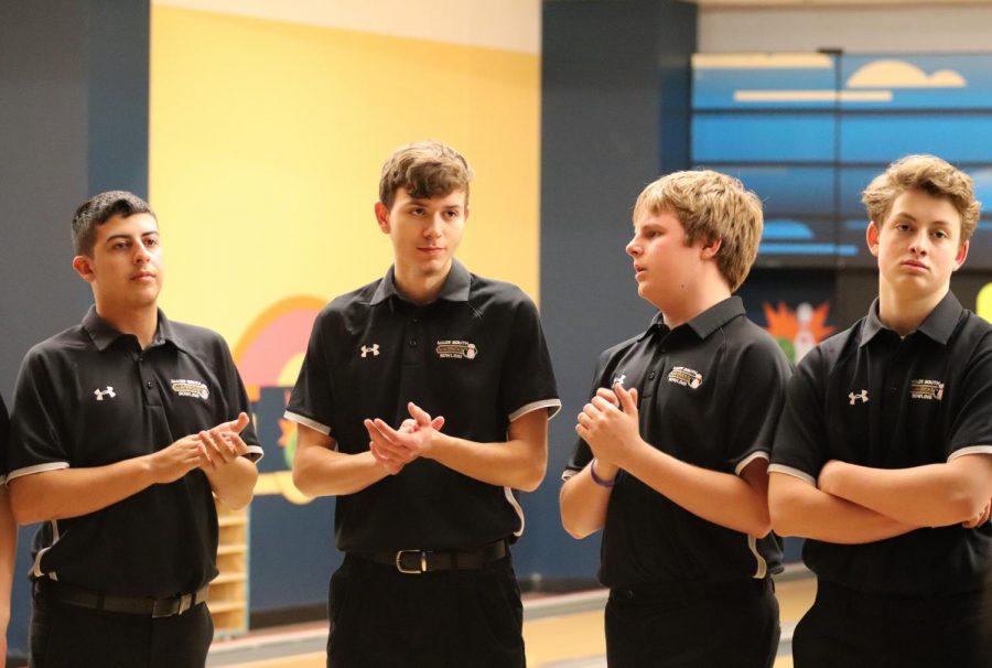 On February 3, 2020, before COVID-19. The boys bowling team congratulate the other bowling who placed in the tournament  at Derby Lanes in Derby, Kansas.  