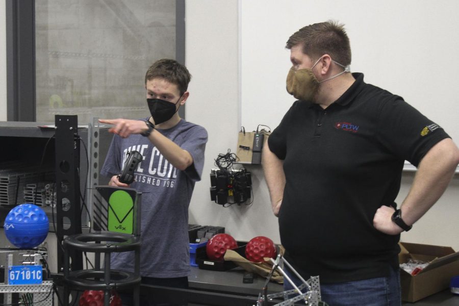 MCA Robotics teacher Zach Helgesen works with Evan Rogerson to prepare a daily practice round and discuss strategy before a Saturday round. The Engineering strand features seven classes at MCA for students interested in engineering, robotics and other technical fields.
