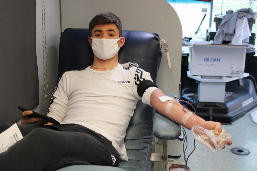 Dylan Christopher donated blood in honor of his sister on Monday, Mar. 22.