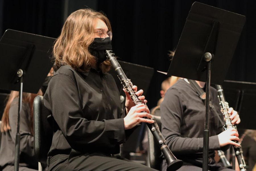 On Tuesday, March 9th, Junior Zoey Ellis plays her clarinet with her other players 