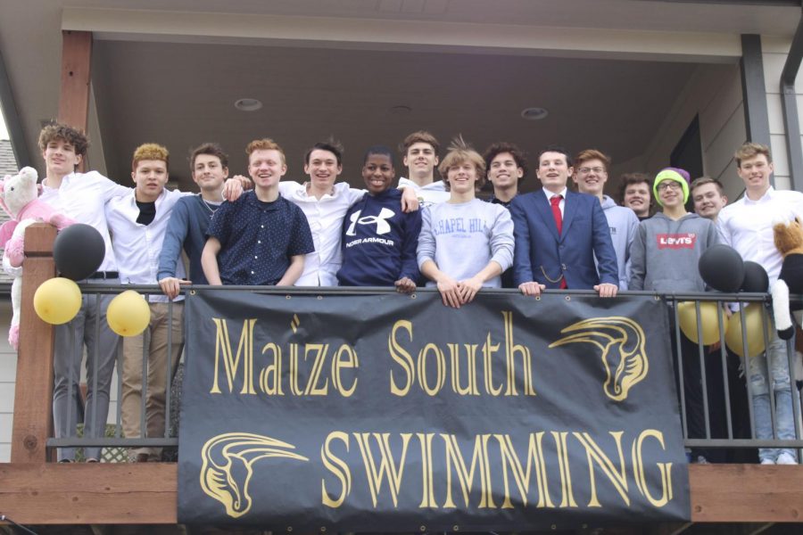 At the end of year swimming banquet, held at the Richardson house in a potluck style this year, the team poses for a final photo of the season. They celebrated their achievements, spent a final day with the teams seniors, and ate some food before the season was over. 