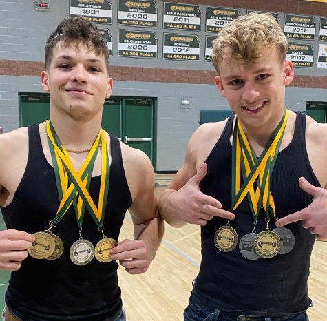 Junior Evan Cantu and Senior Garrett Huff show off their medals at the state powerlifting meet at Larned on Saturday, Feb. 6.  Huff took 1st place in bench, squat and clean and 1st overall in his weight class of 181 pounds.