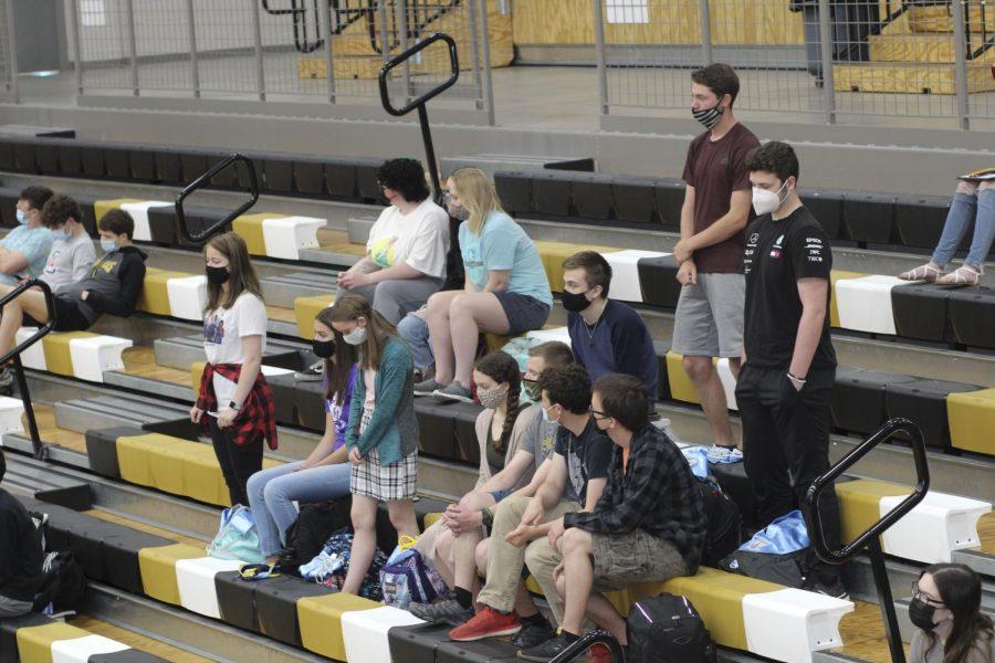 A group of students sit together on the bleachers waiting to receive their academic/sports awards. Between the scholarships and other recognition students got on the day, nearly X amount of money was awarded in total.