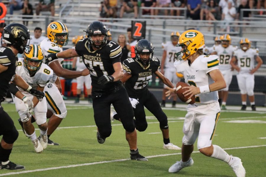 With Salina South breaking their play Senior Blake McComick rushes to the opponents quarterback to receive a tackle. McCormick had a total of five tackles and three assists on the defense. 
