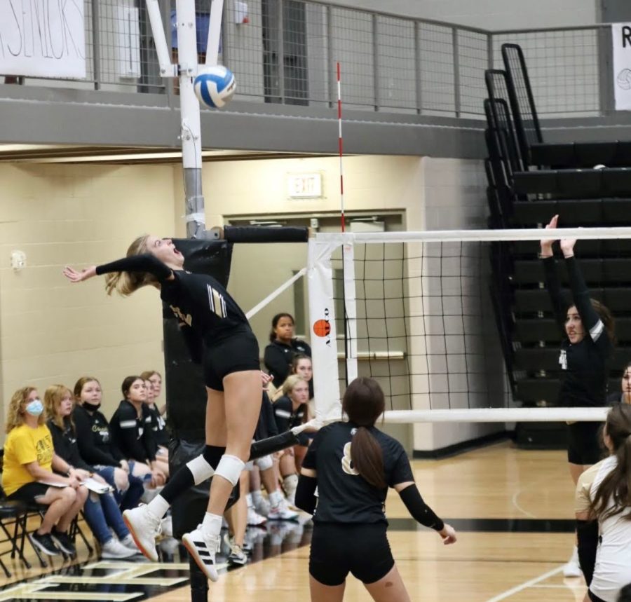 Sophomore Gracie Morrow aggressively goes up  to swing against Campus. The Maize South squad ended up winning that game 2-0 at home on senior night. The Lady Mavericks are 16-3 on the road this season.
