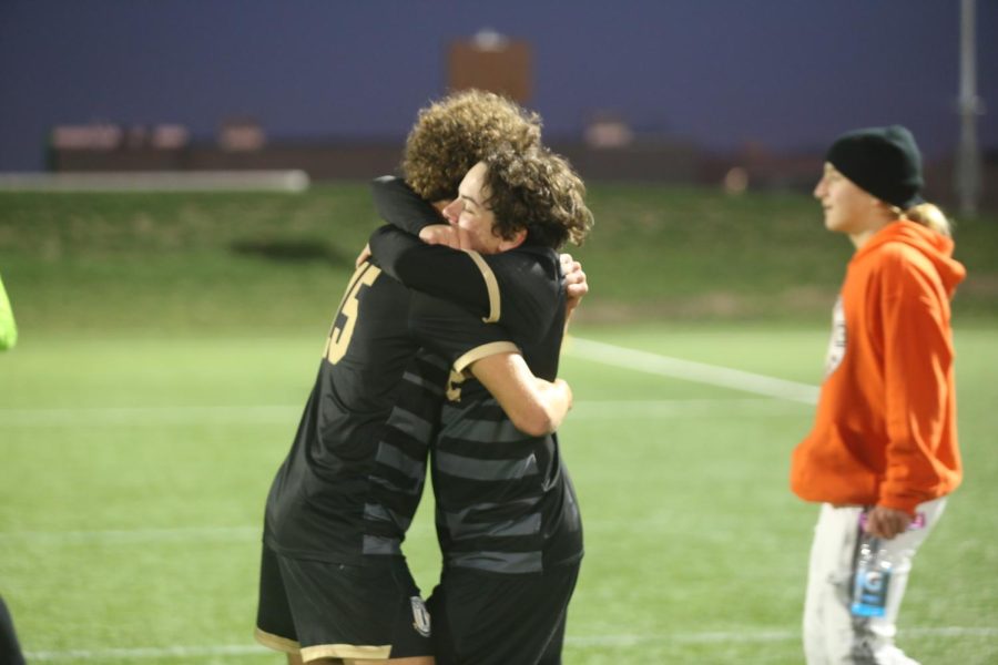 After winning the game, junior Tatum Steinhoff and sophomore Nick Emes run to congratulate each other. 
