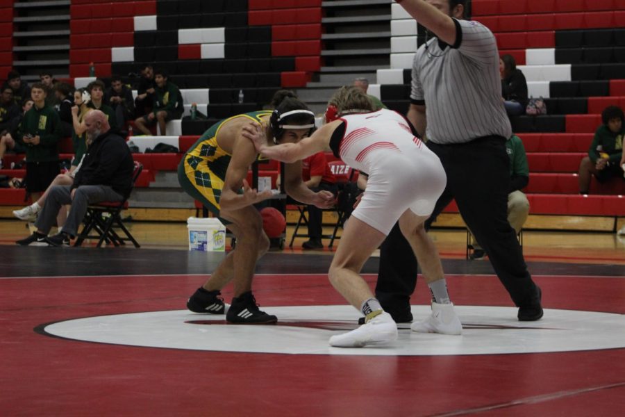 Senior Keton Patterson begins his match against his Salina South opponenet. He later went on to win the match.