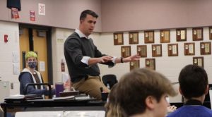 Mr. Siler conducts Maize High band through a practice run on Thursday, Dec. 16. He starts his day at Maize High, moves next to Maize Middle and then finishes his afternoon at Maize Intermediate School.