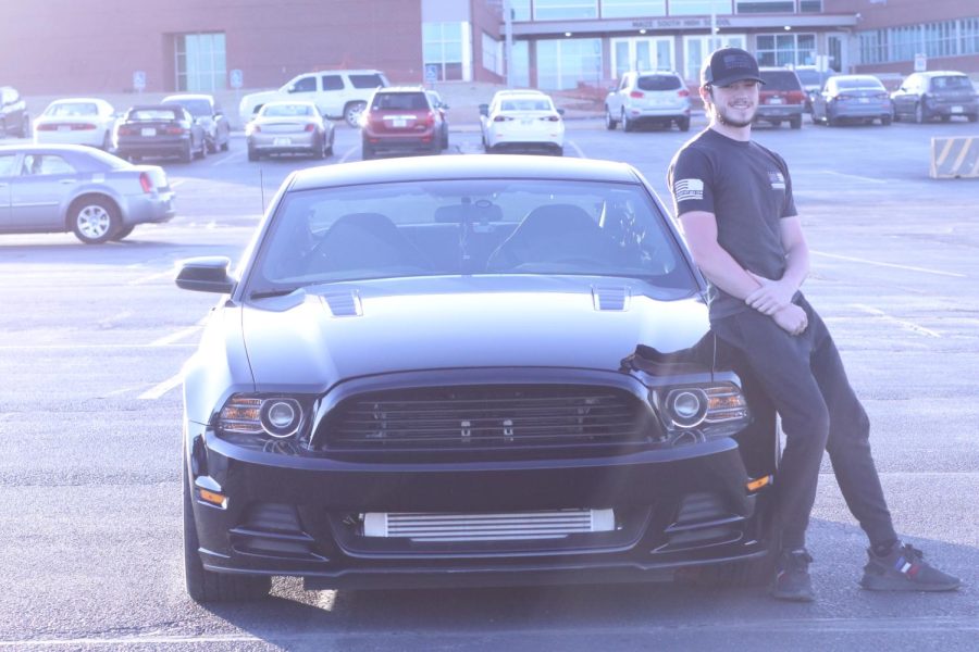 Cornette poses with his 2014 PROCHARGED Mustang. Cornette owns two cars and has fixed both of them.