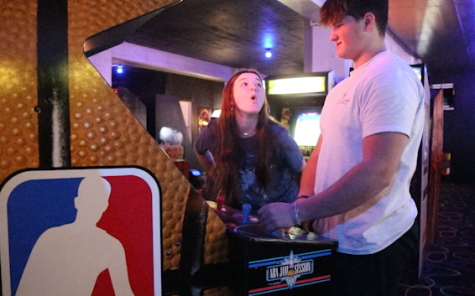 Junior Sarah Conner dunks on senior Gavin Metts while playing a round of NBA Jam at The Arcade on Thursday, March 10.