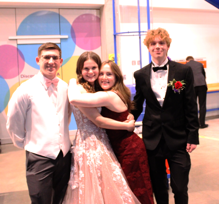 A group of four pose for a picture at Maize High prom. Photo by Leah Brown.