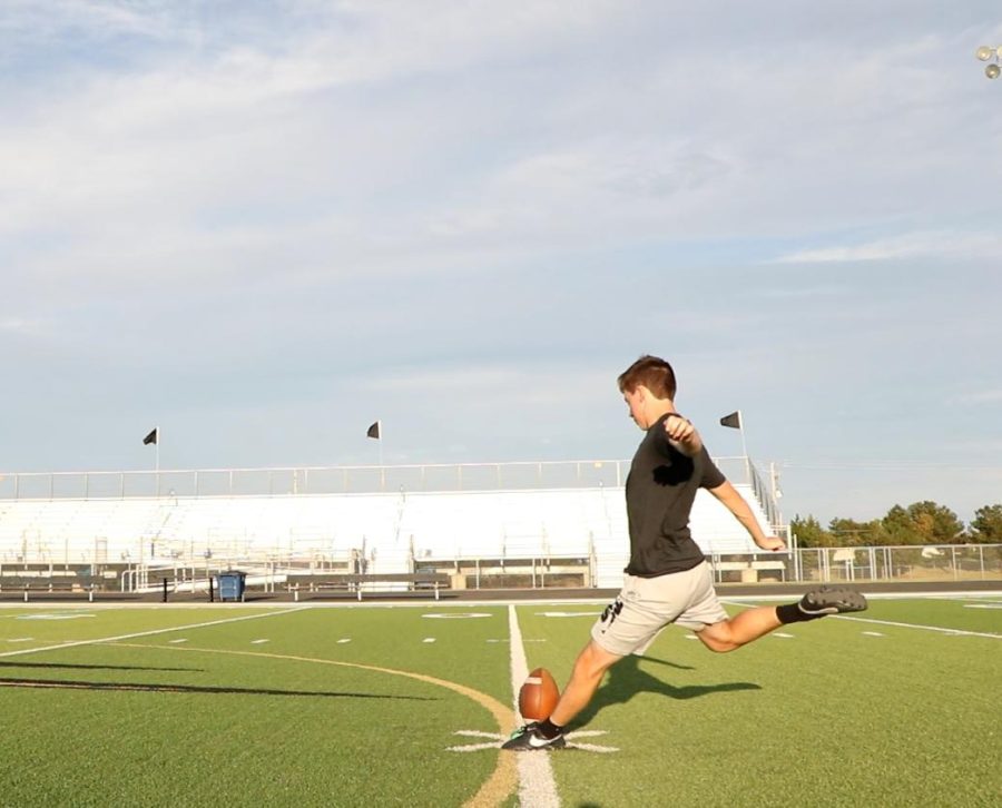 Sophomore kicker Sam Parks practices a kickoff for distance during a practice on Thursday, September 1.