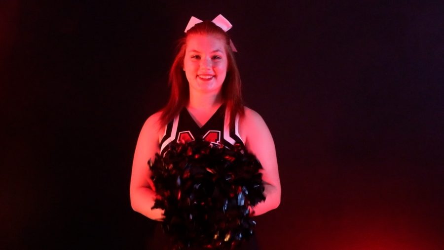 Maize High cheerleader Piper Klaker poses during her studio session for her cheer hype video.