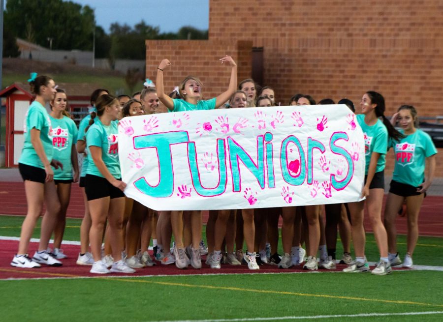 Junior Emmerson Campbell hypes up the junior powderpuff team before they take on the seniors. The seniors defeated the juniors 31-0 last Wednesday.
