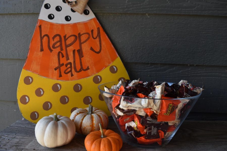 A bowl of Halloween candy sits ready for trick-or-treaters on a neighborhood porch near Maize High School.