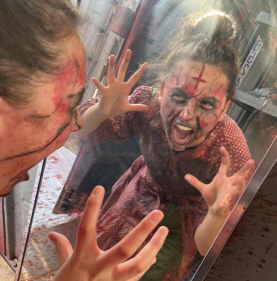 Actress Hannah Moss tests out her terrifying makeup on Sunday, October 16, at Field of Screams. The cast members get to the field 1.5 hour before guests arrive to get their make-up done by an artist and ensure their costume is ready.