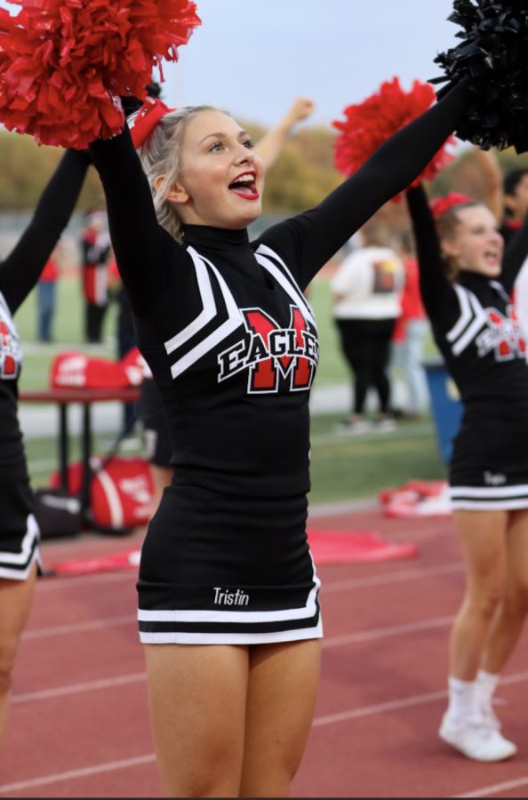 Sophomore Varsity cheerleader Tristian Combs hypes up the crowd moments before the Homecoming game. 