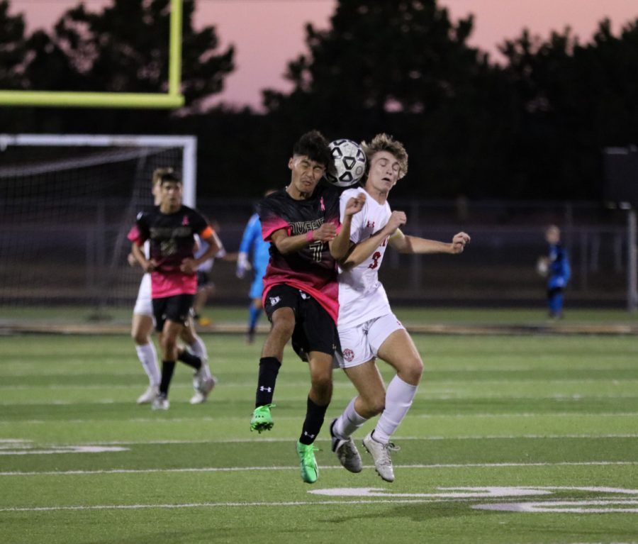 Maize senior Preston Gietzen goes up against Maize South sophomore Danny Derath, both trying to go for a header. Derath finished the game with one Maverick assist. Maize South defeats Maize 4-0. 