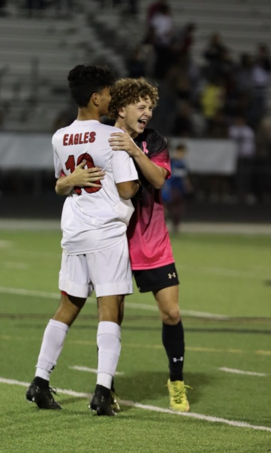 Maize South junior Miles Edwards coming together with opponent, Maize senior Angel DeLeon, post-game. Edwards finished the game with one assist in the first Maverick goal of the game. Maize South defeats Maize 4-0. 

