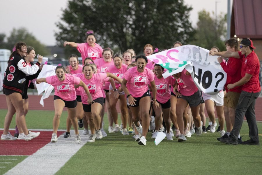 As powderpuff gets ready to begin, seniors Brianna Myovela and Maia Djurovic lead the pack out from the group huddle. “I enjoyed playing powder puff because the girls in our grade all get together,” Djurovic said. “It’s fun trying to work with the boys to try to perform the plays they give us.”