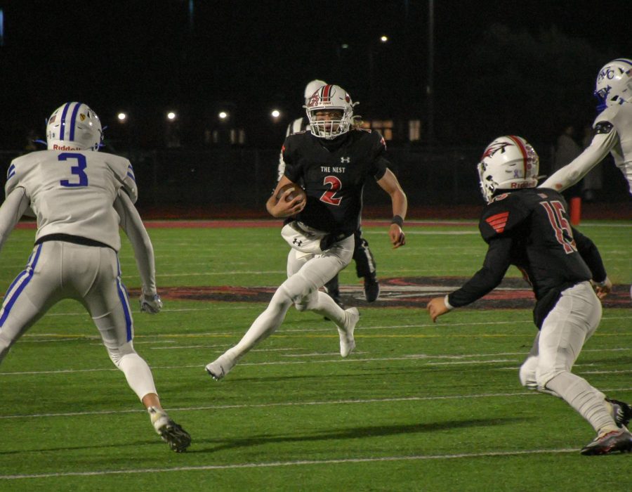 Senior Avery Johnson making a split decision to try and make the gap or run the ball to the outside. Johnson had 61 rushing yards in the rainy game Friday night in which Maize defeated Kapaun 43-14.