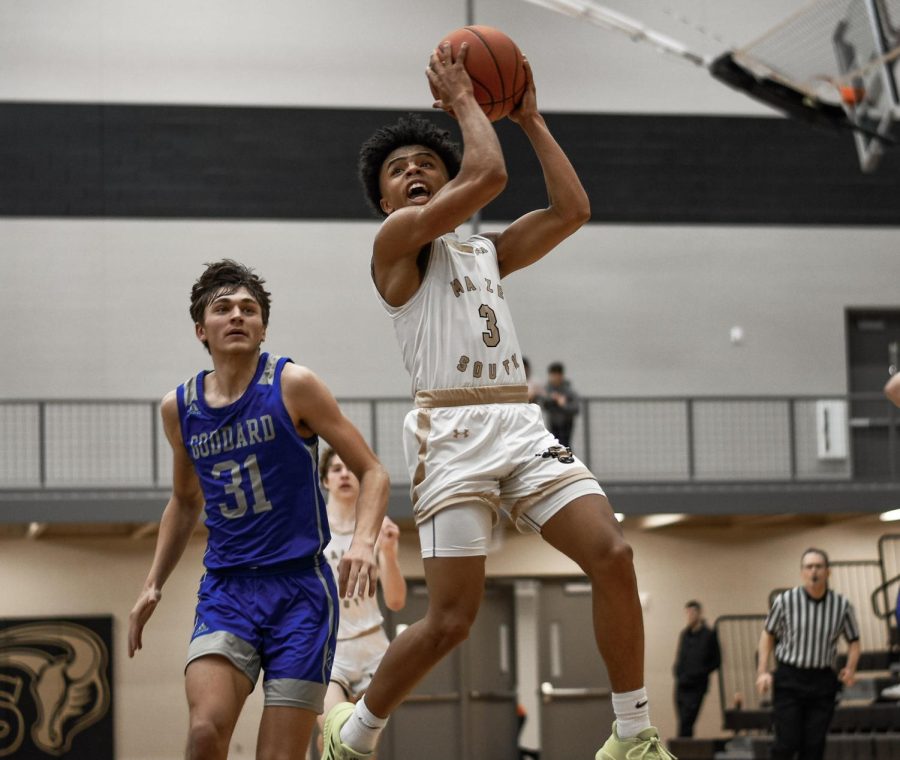 Senior Isaiah Atwater jumps up to put up a shot and is fouled mid-air. “We are just trying to get better everyday so we can continue to win and hopefully be playing our best when the playoffs come around,” said Atwater. Maize South defeated the Goddard Lions 63-30 Tuesday night.