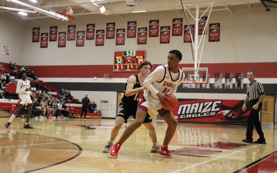 Freshman Jaylen Mason tries to find an opening in the Railers defense in order to pass the ball to his teammates. The Eagles defeated the Railers 64-51, bringing them to a 4-5 overall this season. 