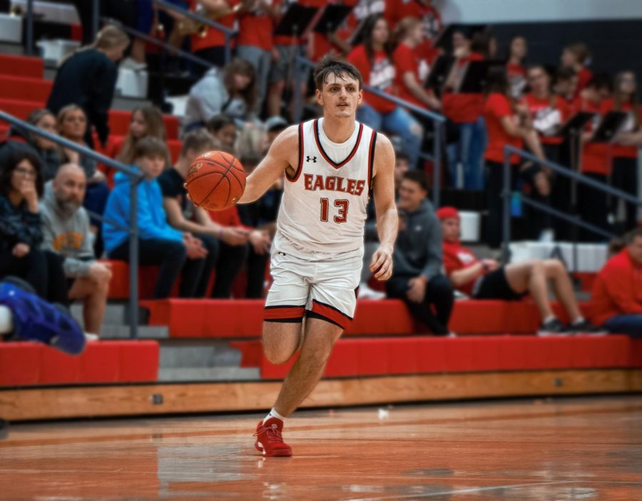 Senior Jaxon Booth drives the ball down the court at the start of the second half. Throughout this season, Booth has averaged 8.0 points per game for the Eagles. Maize fell short in their loss to Hutchinson 46-61 on Tuesday night.
