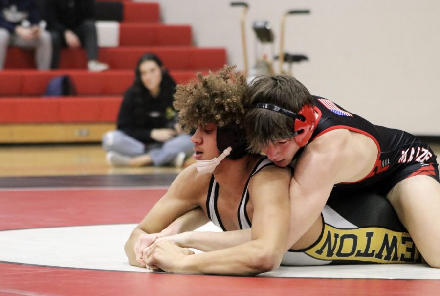 Senior Cody Hughbanks wrestles in weight class 157 against his opponent from Newton. The Eagles defeated Newton for the AVCTL Division 1 Championship. 