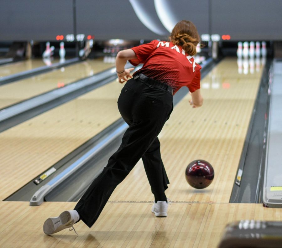 First year bowler sophomore Emily Benninga rolls her ball down the lane. Benninga shot a 256 series Friday morning. The Eagles placed 29th overall in the tournament.
