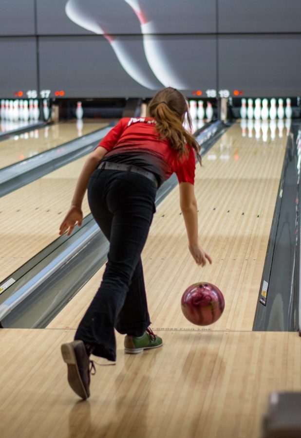Freshman Kiley Gonzales throws her ball down the lane towards the pins. Gonzales had the highest pin total at the end of her three individual games for Maize. The Eagles placed 29th overall in the tournament.
