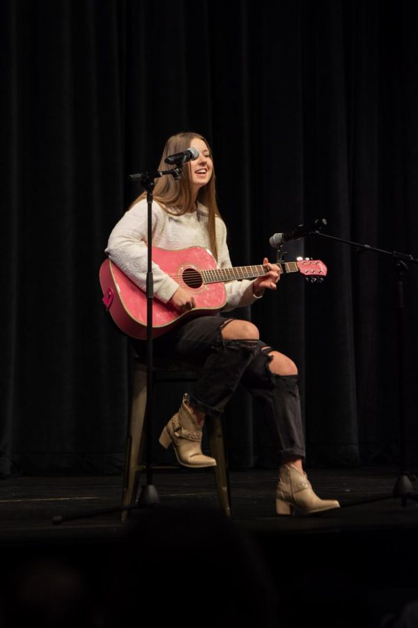 Maize South freshman Reese Beagley plays the guitar and sings the song “Put Your Records On” by Corinne Bailey Rae.
