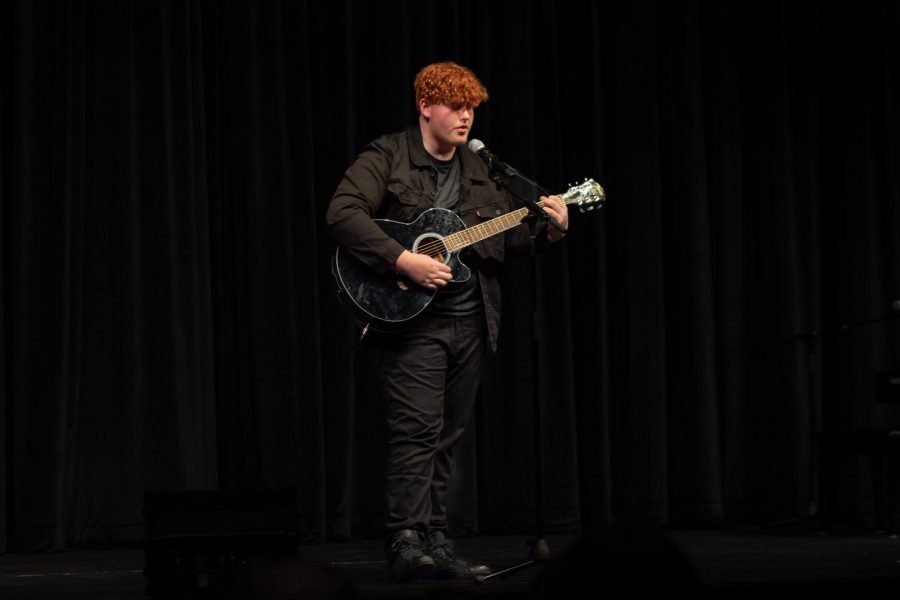 Maize South sophomore Garrett Gassmann plays guitar and sings the song “Let It Be Me” by City Center Worship.
