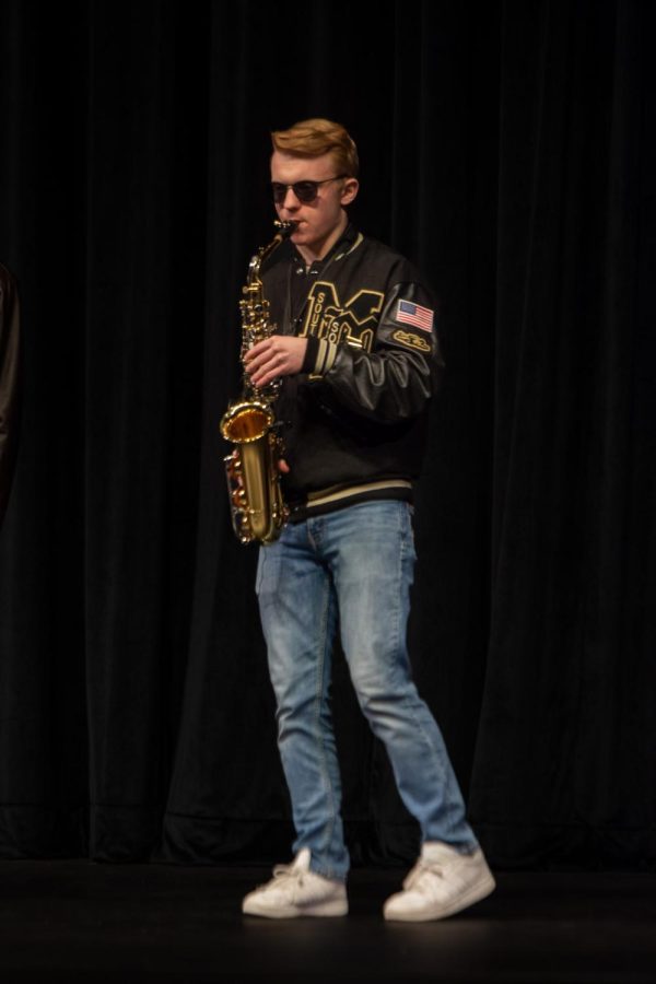 Maize South junior Ammon Sigler plays the saxophone to the song “Careless Whisper.” Sigler was accompanied by junior Micah Gifford who sang along.
