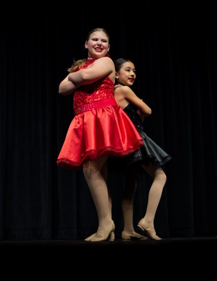 Julia McColm, left, and her dance partner Katie Morales pose together after their dance. The par danced to the song Cant Do It Alone by by Catherine Zeta-Jones and Taye Diggs.