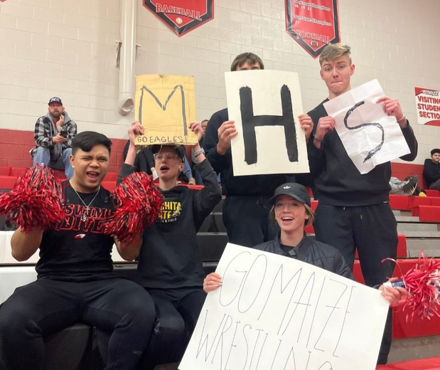 Maize High students show support for their school at a wrestling meet on Thursday, Feb. 2. Around 100 students from Red Rage attended the final dual of the season which decided who became the AVCTL Division 1 champion.