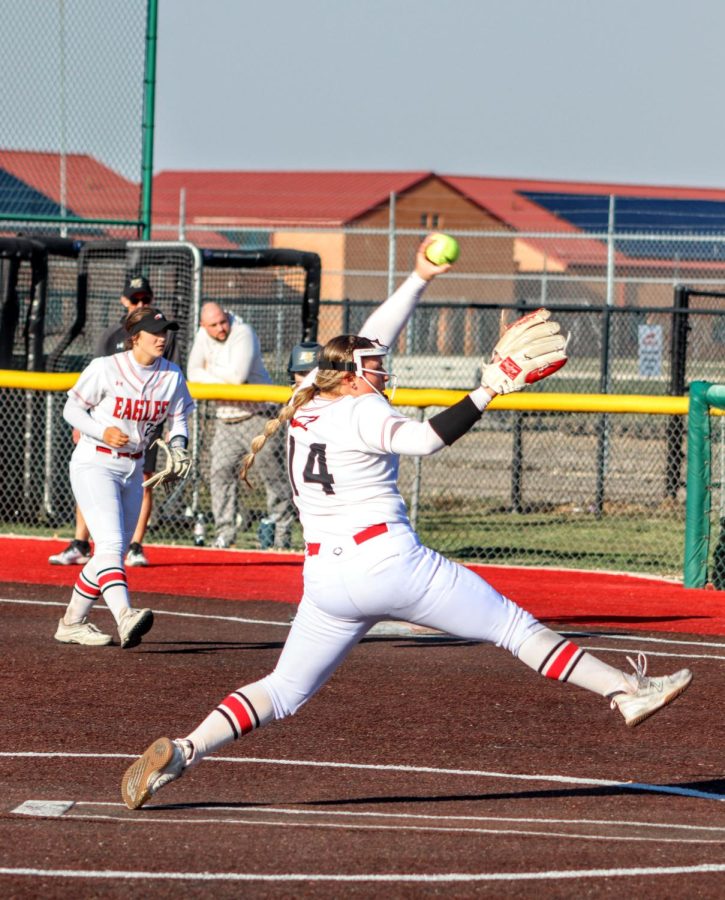 Maize High freshman Joslynn Stiglitz pitches to Maize South during the 5th inning. Stiglitz pitched the majority of the first game. The Eagles defeated Maize South 10-5 on Thursday, April 6.