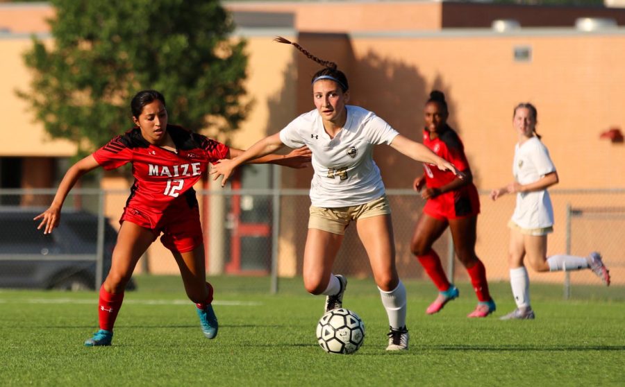 Maize South sophomore Olivia Oenning tries to keep the ball away from Maize junior Lilliana Cortez. The Eagles are 2nd in the Ark Valley-Chisholm Trail Division. 