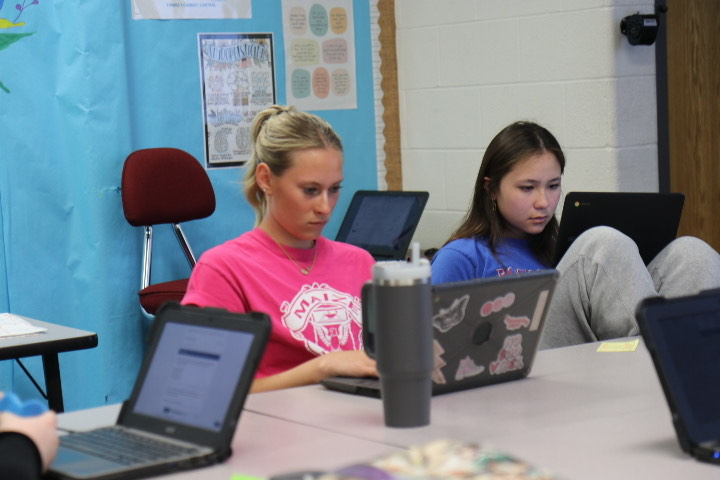 Senior Teagen Redinger and sophomore Arden Chapman work on a quiz in Ms. Hawthornes government class.