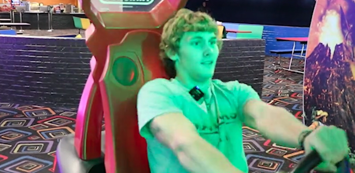 Maize South senior Noah Byer sitting in a large chair at an arcade.