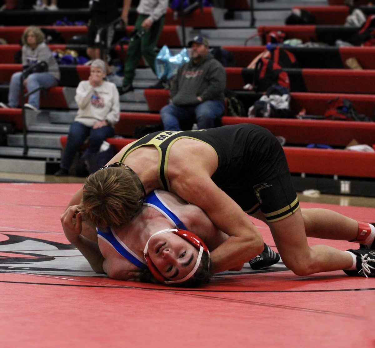 Wrestler pinning his opponent in the match.