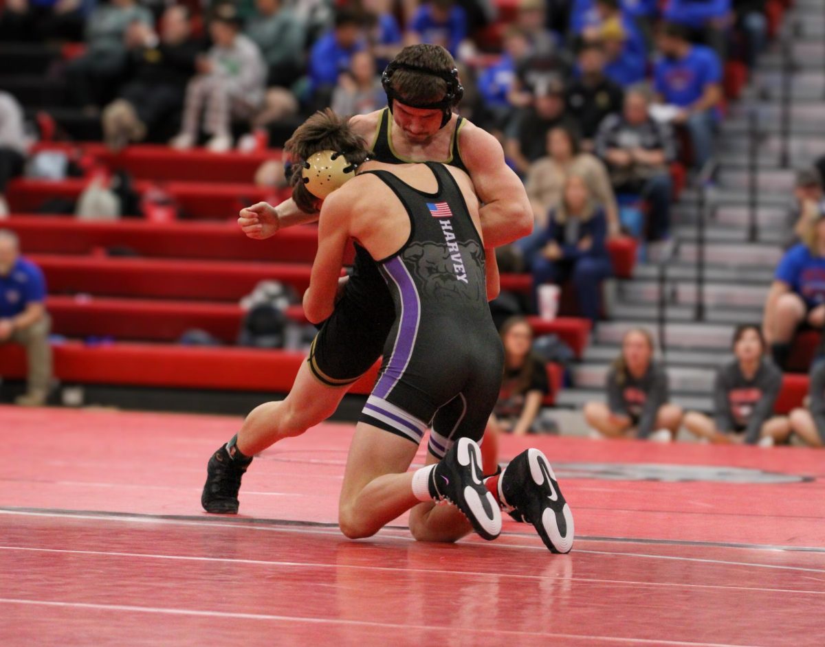 Senior Isaiah Lowe pins his 150 opponent, M. Harvey, from Baldwin High School first period. Lowe won first place in his weight class and was undefeated 5-0.