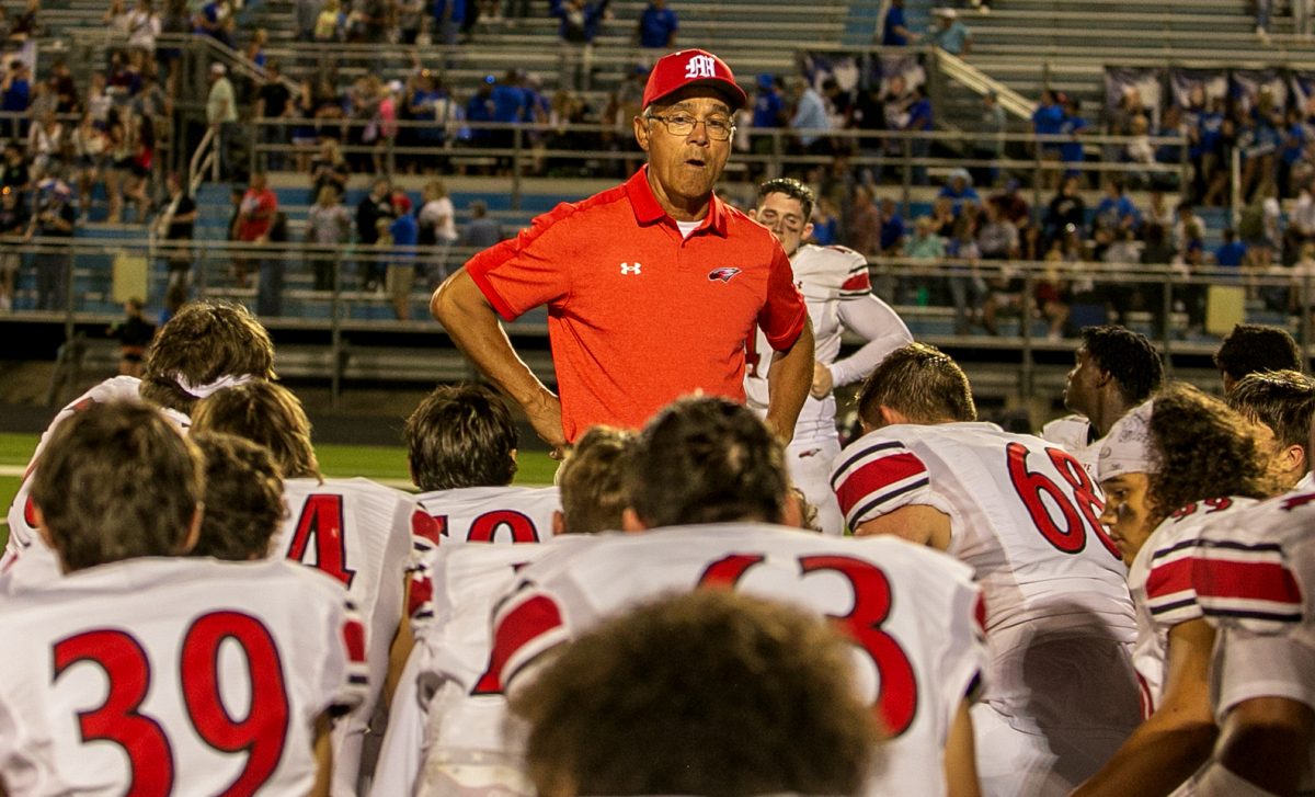 Head Coach Gary Guzman talks with all the players after the loss.